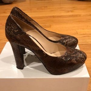 Snakeskin platform pumps
